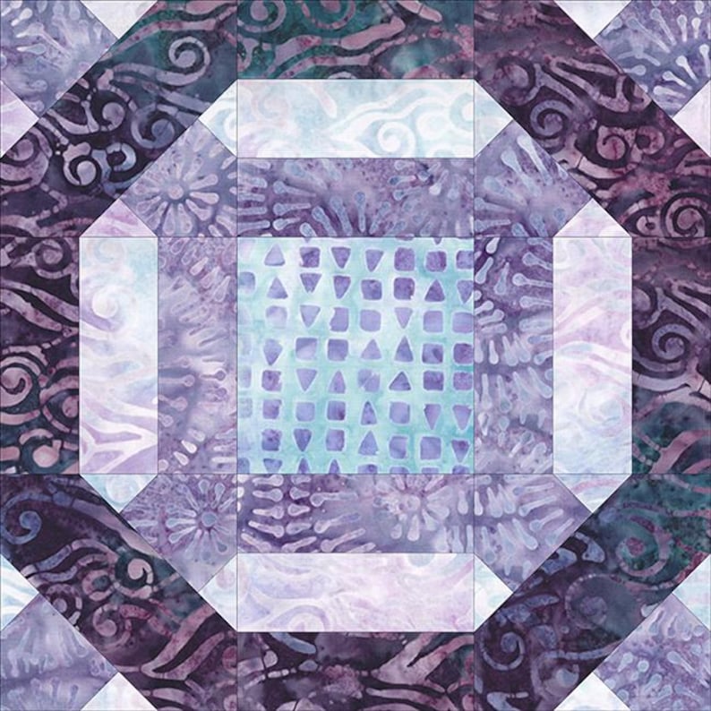 May include: A quilt block with a geometric design in shades of purple, blue, and white. The center of the block features a pattern of small triangles and squares.
