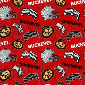 May include: Red patterned fabric featuring Ohio State Buckeyes logos, helmets, and the text "OHIO STATE" and "BUCKEYES". The design includes a repeating pattern of the team's mascot and football helmets.