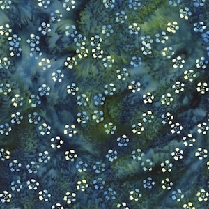 May include: A batik fabric design with small, white and blue floral patterns on a dark blue and green background. The fabric has a textured appearance, with a watercolor-like effect, suitable for various craft projects.