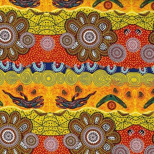 May include: A vibrant, patterned fabric featuring an Aboriginal art design. The design includes large, brown floral shapes, dotted patterns, and stylized animal and boomerang motifs in shades of yellow, orange, red, and blue.