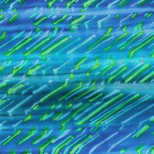 May include: Abstract blue and green fabric with a diagonal pattern of lines and swirls.