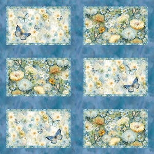 May include: Watercolor floral fabric panels featuring butterflies and flowers in shades of yellow, white, and blue. The panels have a light blue border and are set against a textured blue background. The fabric is suitable for various craft projects.