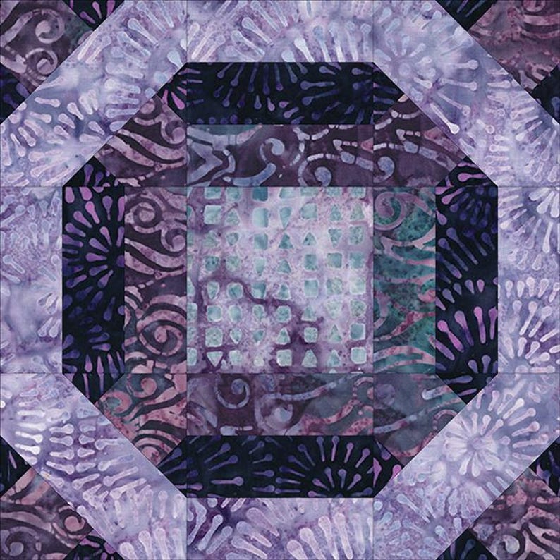 May include: A purple and blue quilt block with a geometric pattern. The block is made up of squares and rectangles, and the fabric has a variety of patterns, including swirls, dots, and stars.