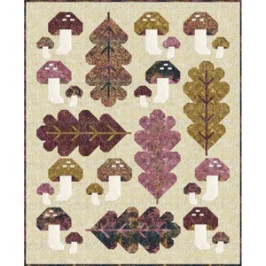 May include: A patchwork quilt featuring a repeating pattern of mushrooms and leaves in shades of brown, purple, and green. The quilt has a cream-colored background and is likely handmade, showcasing a rustic, autumnal theme.