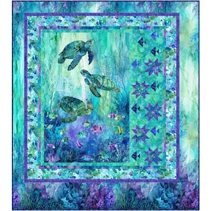 May include: A rectangular quilt featuring an underwater scene with three sea turtles swimming among coral and small fish. The design includes shades of teal, blue, and purple, with a vertical border panel displaying star and fish motifs.