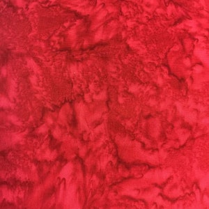 May include: Red fabric with a marbled pattern. The fabric has a subtle texture and a deep red color with darker red and brown swirls.