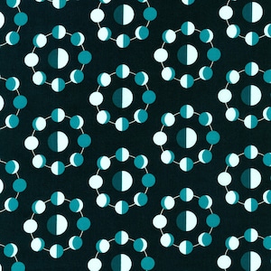 May include: A seamless pattern of teal blue circles with white half-circles arranged in a repeating pattern on a dark blue background.