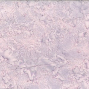 May include: A close-up of a light purple fabric with a marbled pattern. The fabric has a soft, textured surface.