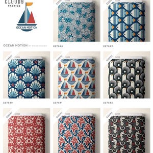May include: A collection of patterned fabric samples with nautical and ocean-themed designs. The fabrics feature sailboats, fish, seashells, coral, and seahorses in various colors, including blue, red, and white. The "Ocean Motion" collection is by Cloud9 Fabrics.