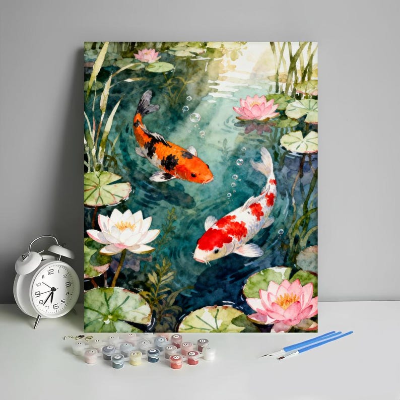 May include: Watercolor painting of two koi fish swimming in a pond with lily pads and lotus flowers. One fish is orange and black, the other is white and red. The water is a deep teal color.
