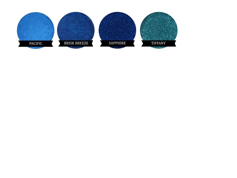 May include: Four round eyeshadow samples in shades of blue and teal. The shades are labelled "Pacific", "Brisk Breeze", "Sapphire", and "Tiffany".