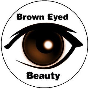 May include: A brown eye with a white background and the text "Brown Eyed Beauty" in black.
