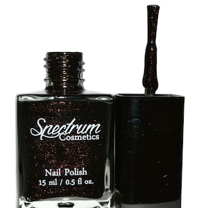 May include: A black nail polish bottle with a red glitter finish. The bottle is labeled "Spectrum Cosmetics" and "Nail Polish 15 ml / 0.5 fl oz."