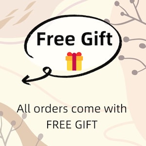 May include: A graphic design on a cream background featuring a black outlined speech bubble containing the text Free Gift and a yellow gift box icon with a red ribbon. Below the bubble, the text reads All orders come with FREE GIFT.