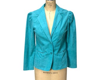 Blazer azul de los años 70 con mangas abullonadas y cuello con solapas de Jonathan Sportswear. Talla S/M.
