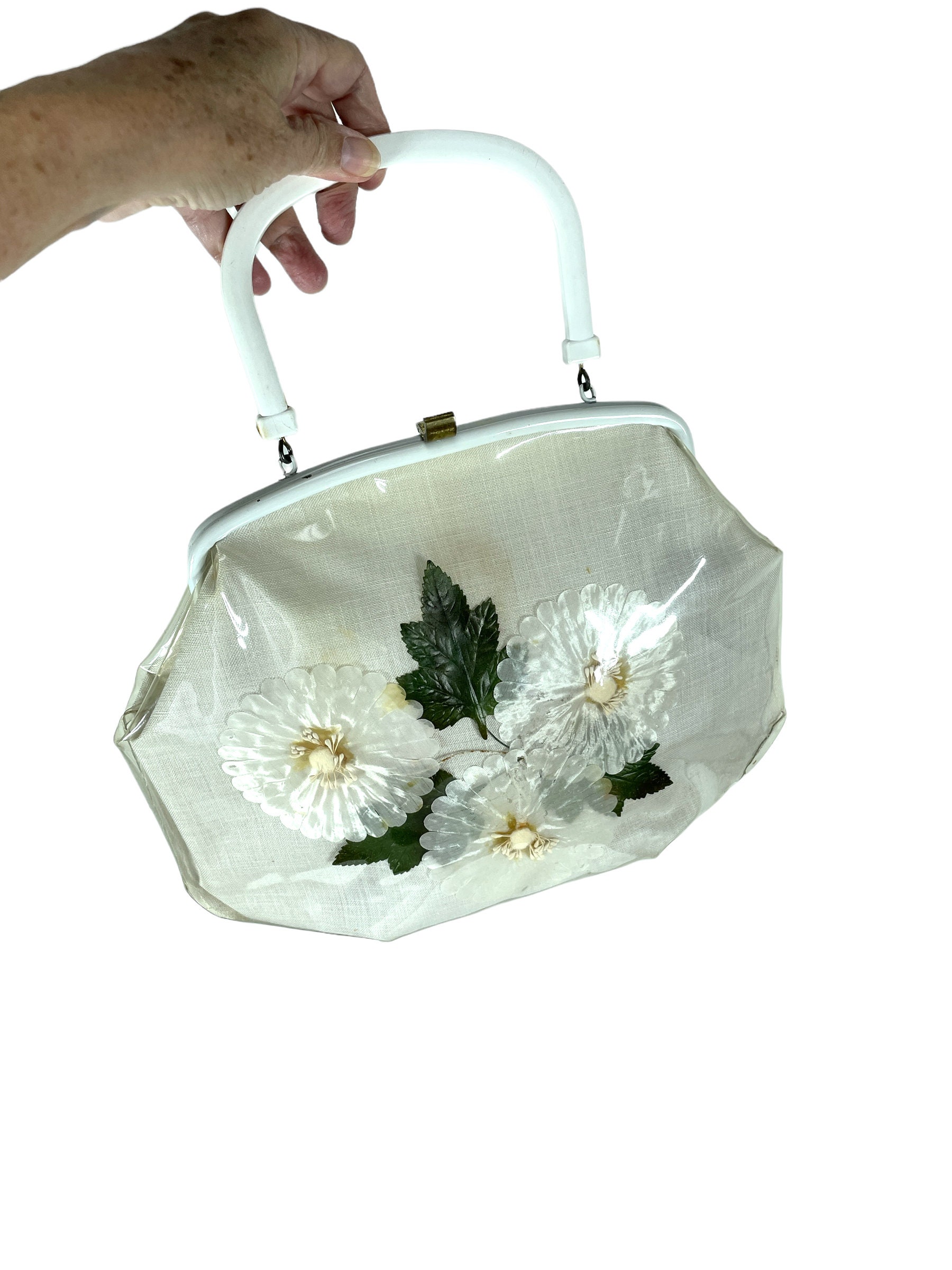 Now in the shop…….1950s Clear plastic overlay silk daisy and plastic Lily  of the Valley flower w/Bakelite handle. Beautiful vintage… | Instagram