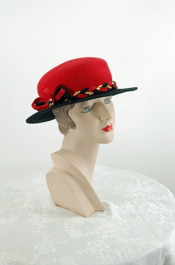 Red and black wool felt vintage hat with gold meta