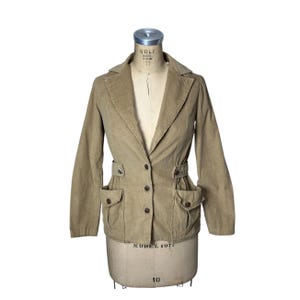 May include: A handmade, wooden cutting board with a natural finish. The board features a live edge on one side and a rectangular shape. It is approximately 18 inches long and 12 inches wide.