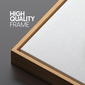 May include: Close-up of a canvas print with a wooden frame. The canvas is white and textured, and the frame is made of light brown wood. The text "HIGH QUALITY FRAME" is printed in white on the upper left corner.
