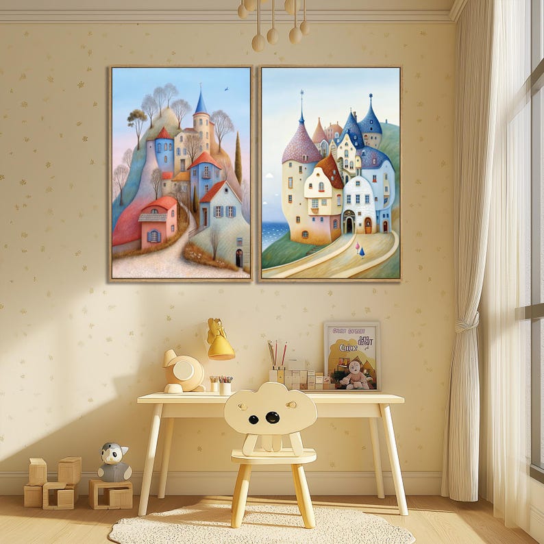 May include: Two framed landscape paintings depict colorful European-style villages on hillsides. The artwork features buildings with red, blue, and white facades, set against a blue sky. The paintings are displayed above a child's desk with a cloud-shaped chair.