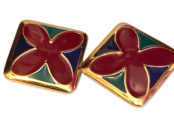 May include: A pair of gold-toned earrings with a square shape and a red, green, and blue enamel flower design.