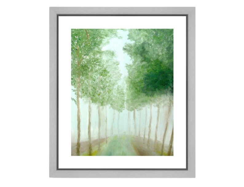May include: A framed landscape painting depicting a path through a forest. The artwork features tall, slender trees with green foliage lining a path that recedes into the distance. The painting is encased in a silver frame.