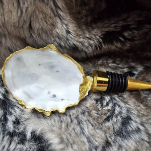 Oyster shell wine bottle stopper.