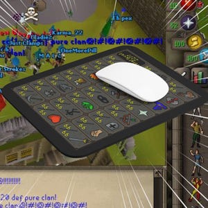 May include: A black rectangular mousepad with a gaming theme, featuring various icons and the number "66" repeated. A white wireless mouse rests on the pad. The background shows a video game interface with text like "Eh pex" and "Karma_22".