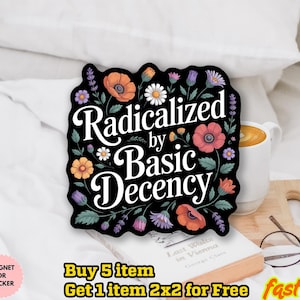 May include: A black sticker with the text "Radicalized by Basic Decency" in white, surrounded by colorful flowers. The sticker is on a book with a coffee mug and glasses in the background. The sticker is water-resistant and can be used as a magnet.