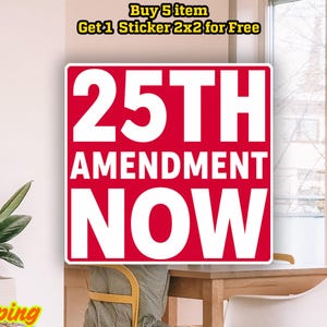 May include: A red and white sticker with the text "25TH AMENDMENT NOW". The sticker is rectangular and prominently displayed. The image also includes a plant, a macrame wall hanging, and text that says "Buy 5 item Get 1 Sticker 2x2 for Free".