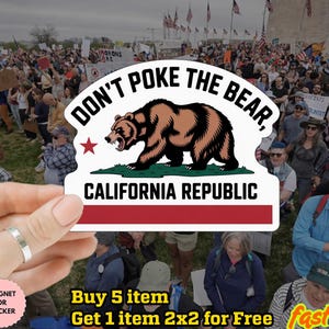 May include: A white sticker with the text "DON'T POKE THE BEAR, CALIFORNIA REPUBLIC" and a brown bear graphic. The sticker is held in front of a crowd of people. The sticker is water proof and can be used as a magnet.