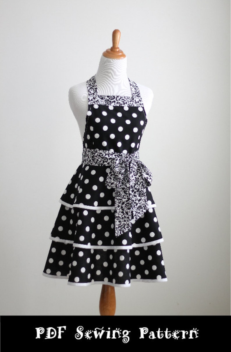 May include: A black and white polka dot apron with a tiered skirt and a patterned waistband and neck strap. The apron is displayed on a mannequin. The text "PDF Sewing Pattern" is at the bottom.
