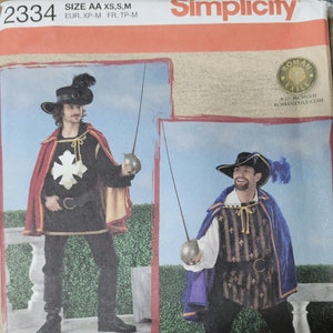 May include: Simplicity sewing pattern number 2334 for a men's costume. The pattern includes instructions for making a doublet, breeches, and a cape. The pattern is for sizes XS, S, and M.