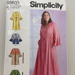 May include: A Simplicity S9603 sewing pattern envelope for a robe with a V-neckline, tie waist, and flared sleeves. The cover displays four variations of the garment in yellow, blue, pink, and green patterns, with sizing information for U.S. 18W-24W.