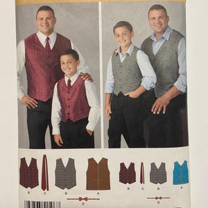May include: Simplicity pattern 1506A features vests and ties. The cover shows a man and a boy wearing vests in various colors and patterns. The pattern includes sizes S-L and 1XL-5XL. The vests have different designs, including a brown, a patterned burgundy, and a blue vest.