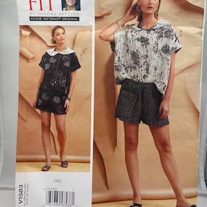 May include: A Vogue Patterns sewing pattern titled "Today's Fit" by Sandra Betzina. The pattern features two different outfits: a short-sleeved top and shorts, and a dress with a Peter Pan collar. The pattern number is V1583.