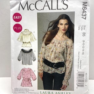 May include: A McCall's M6437 sewing pattern envelope for a Laura Ashley blouse. The front displays the brand name, pattern number, size B5 (8-10-12-14-16), and illustrations of four blouse variations with different necklines and sleeve lengths.