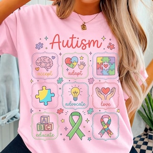 May include: A white ceramic mug with a black handle and the text "But First, Coffee" in a bold, black font. The mug is set against a neutral background, highlighting its simple design.