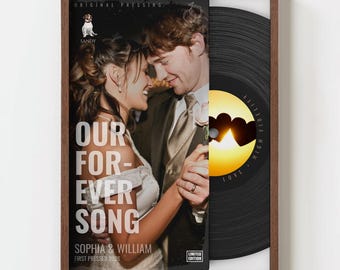 May include: A framed vinyl record with a wedding theme. The album cover features a couple dancing, with the text "OUR FOREVER SONG" and names "SOPHIA & WILLIAM". The record label shows a sunset and the word "LOVE".