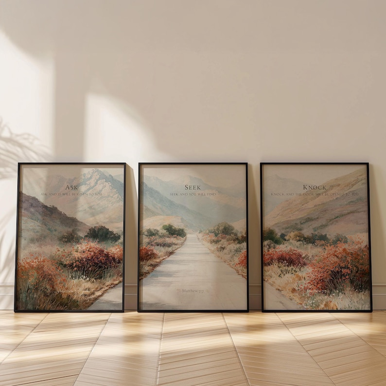 May include: Three framed landscape art prints with black frames. Each print features a scenic view of a road winding through a mountain landscape. The prints have text that reads "Ask", "Seek", and "Knock".