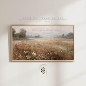 Può includere: Una stampa incorniciata di un paesaggio con un campo di erba alta e fiori selvatici in tonalità tenui. L'opera d'arte include il testo "COME TO ME, ALL WHO LABOR AND ARE HEAVY LADEN, AND I WILL GIVE YOU REST. Matthew 11:28."