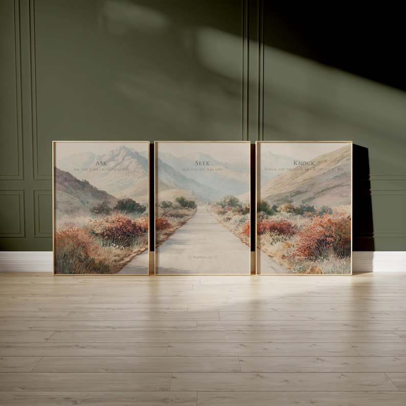 May include: Set of three framed landscape art prints. Each print features a path leading towards mountains, with text at the top. The text reads "Ask", "Seek", and "Knock". The artwork has a muted color palette.