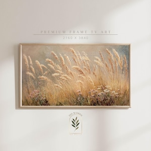 May include: A framed print depicting a field of tall, golden grasses and wildflowers under a soft, muted sky. The artwork includes the text "THE GRASS WITHERSTAND THE FLOWER FALLS, BUT THE WORD OF THE LORD REMAINS FOREVER". The frame is a light wood colour.