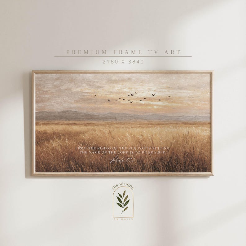 May include: A framed landscape print featuring a field of tall grass under a sunset sky with flying birds. The print includes the text "FROM THE RISING OF THE SUN TO ITS SETTING, THE NAME OF THE LORD IS TO BE PRAISED. Psalm 113:3."