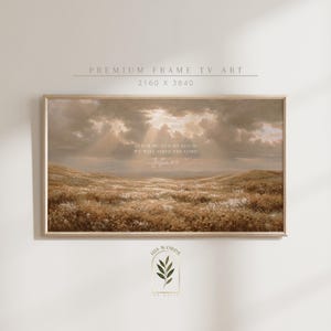 Könnte beinhalten: Gerahmter Kunstdruck mit einer Landschaftsszene unter einem bewölkten Himmel. Das Kunstwerk enthält den Text "AS FOR ME AND MY HOUSE WE WILL SERVE THE LORD Joshua 24:15". Der Rahmen hat eine helle Holzfarbe.