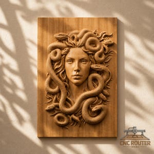 May include: A rectangular wooden wall plaque featuring a detailed relief carving of a face surrounded by multiple snakes. The natural wood grain is visible throughout the piece, which includes the text CNC ROUTER IDEAS in the bottom corner.