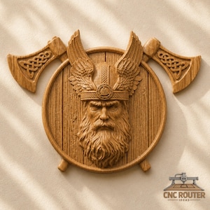 May include: A light brown wooden wall carving featuring a central circular shield with a bearded warrior wearing a winged helmet and a Valknut symbol. Two crossed axes with intricate Celtic knotwork patterns are positioned behind the shield.