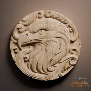 May include: A detailed, light-colored wooden carving of an eagle's head, set within a circular frame with ornate, swirling patterns. The eagle's eye is focused, and the beak is sharply defined. The carving is likely for wall decor.