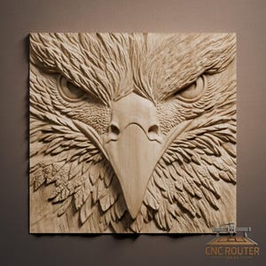 May include: A detailed, carved wooden relief of an eagle's head. The artwork features intricate feather details, a sharp beak, and intense eyes. The piece is mounted on a square wooden panel, showcasing the craftsmanship of CNC Router Ideas.