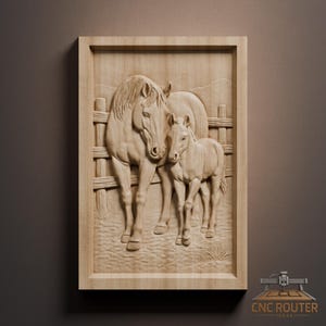 May include: A framed wooden relief carving depicting a mare and foal beside a wooden fence. The artwork shows detailed textures and shading, highlighting the horses' forms and the surrounding landscape. The carving is in a rectangular frame.